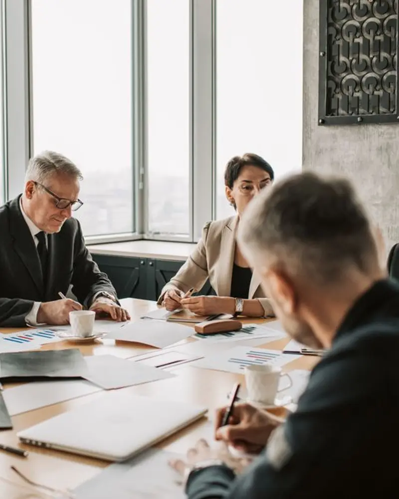 Colleagues gathered around a conference table