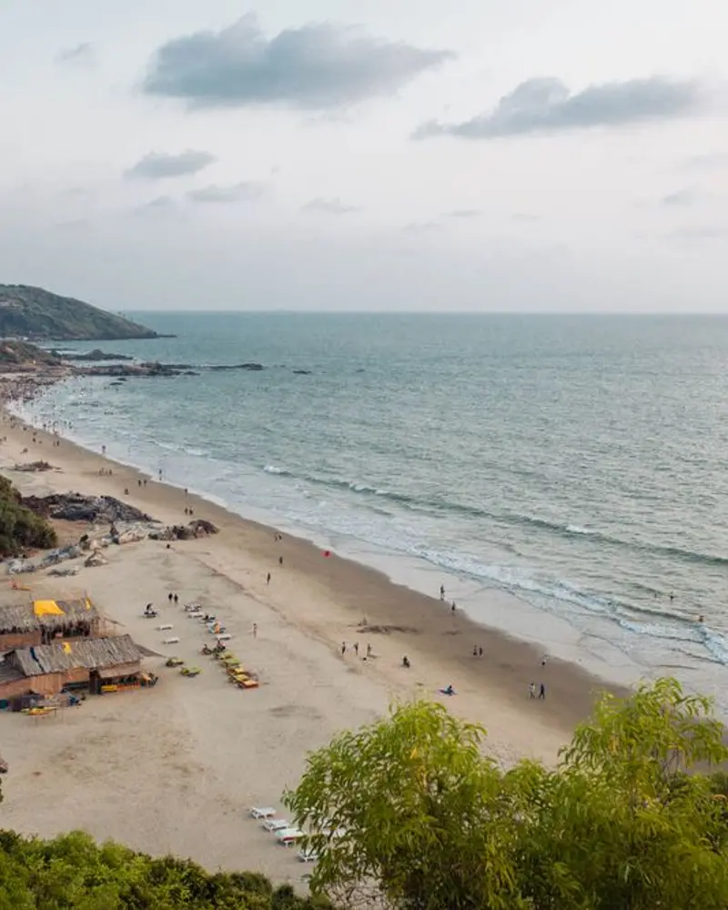 Green headland overlooking Chapora Beach in Goa